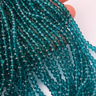 Cristalli Rondella Blu Petrolio Trasparente 4mm
