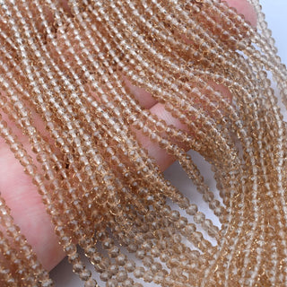 Cristalli Rondella Beige Trasparente 3mm
