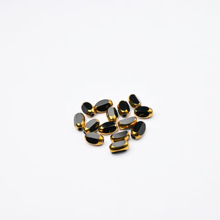 Cristalli Ovale Nero e Oro 7x4mm - 14 pz | Sarobidy
