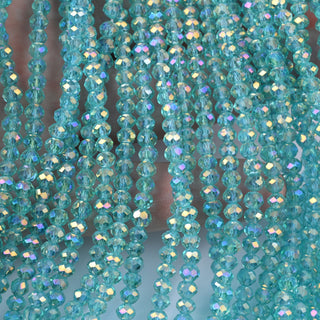 Cristalli Rondella Turchese Trasparente AB 4mm